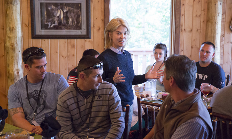 Greta Van Susteren addresses the wounded heroes and their spouses during their first meal together in Alaska.