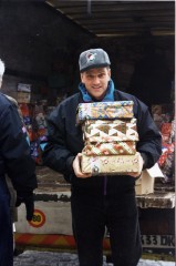 Franklin Graham delivers shoebox gifts to children in Bosnia. The program has grown from 28,000 the first year to over 100 million.