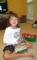Karen's daughter, Kate, puts together a shoebox at the packing party.