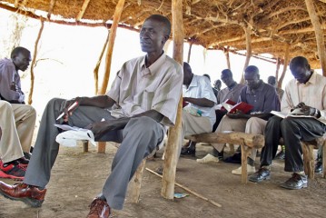 Pastor Abraham is thankful that he can help replace the Bibles that many of the refugees left behind.