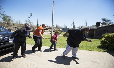 Disaster relief volunteers and staff writer, Nikki, join Miss Nellie in her driveway for a quick dance lesson.