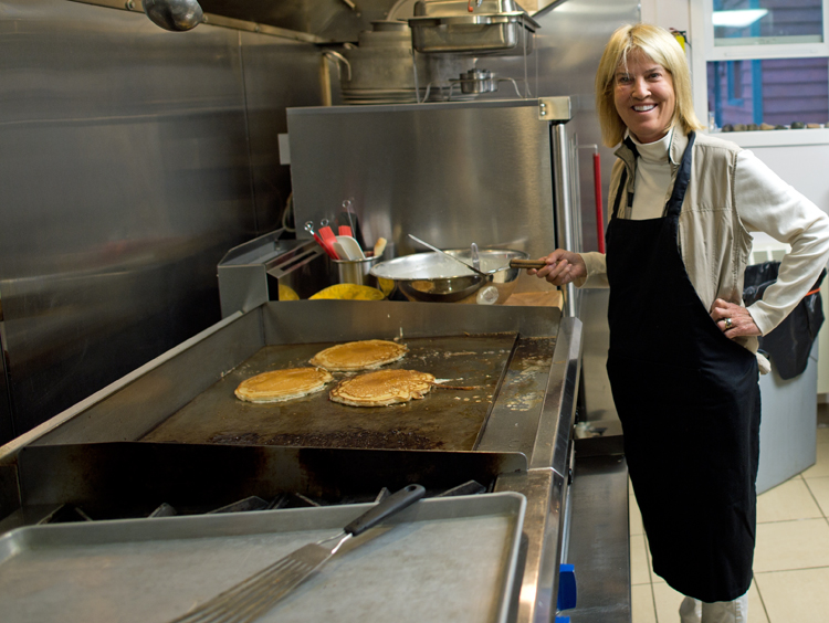 Fox News host Greta Van Susteren cooks her famous Gretacakes for the staff and volunteers at Samaritan Lodge Alaska.
