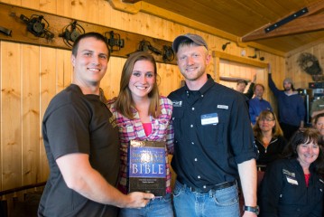 Samaritan Lodge guide Carlin Toews presented Blake and Heidi Clotfelter a new Bible.