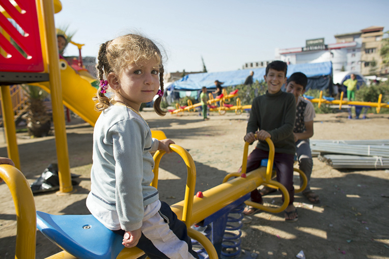 Playground equipment provided by Samaritan's Purse helps bring joy to children in the camp.
