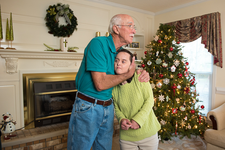 Wayne Watford hugs his daughter Tina. They're home for Christmas.