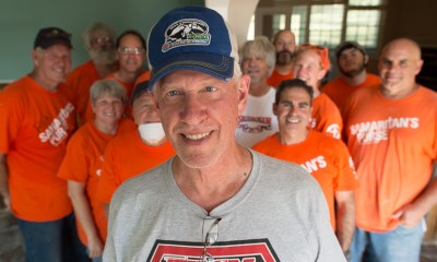 Royce Ogle stands before a group of Samaritan's Purse volunteers who worked on his home in Louisiana.