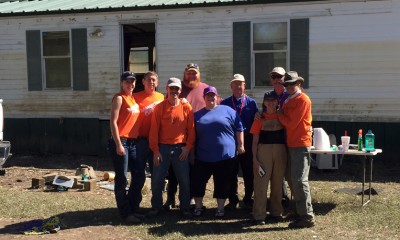 Samaritan's Purse volunteers assist a wounded veteran at his home on Good Friday in Texas. flooding relief