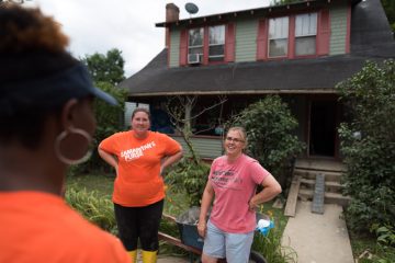 Samaritan's Purse volunteers meet with Amy Humen (right) outside her childhood home in White Sulphur Springs, West Virginia.