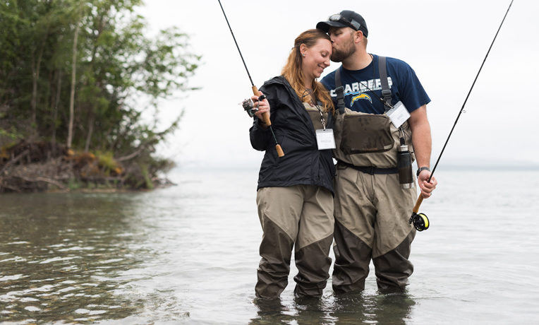 A military couple enjoys fishing in Alaska as part of the Samaritan's Purse marriage ministry to combat-wounded veterans and their spouses
