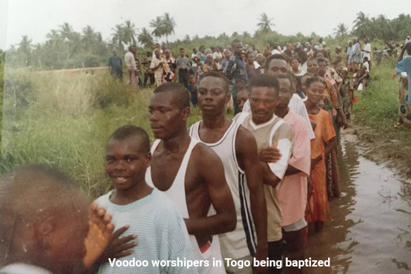 Voodoo worshipers in Togo being baptized