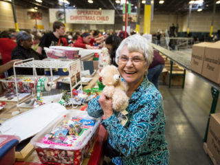 Woman volunteering at an Operation Christmas Child processing center