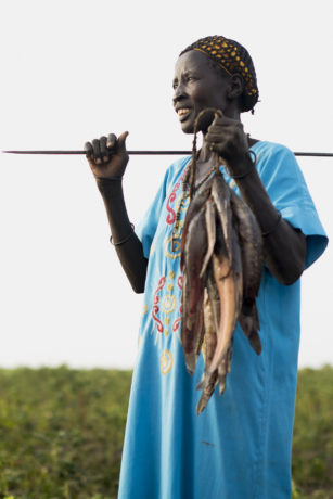 Regina, farms and fishes in Aweil. SP provided seeds, tools and training for this community farm