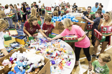 The surrounding community poured into the Forest Hills Baptist Church gym to pack shoeboxes.