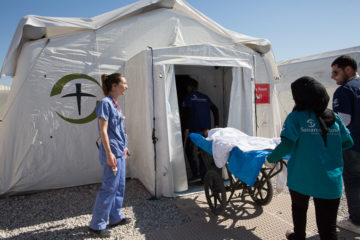 A patient is taken to the emergency room at the field hospital near Mosul.