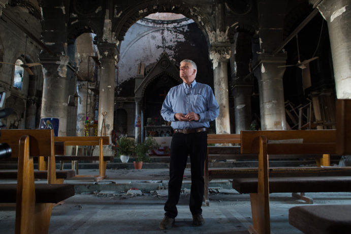 Franklin Graham stands inside a church destroyed by ISIS in Qaraqosh, a traditional Christian village outside of Mosul, Iraq.