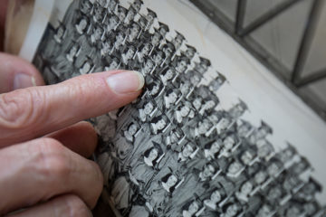 Delores points to her husband, Gary, standing to the left of her in their high school graduation photo.