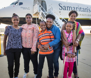 The Tanzania bus crash survivors prepare to return home with their mothers aboard the Samaritan's Purse DC-8.