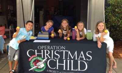 Anna (right) and Tracy (second from right), then 11 and 7 respectively, host the Operation LemonAid stand in the Musselwhite driveway together with their friends.