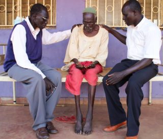 Two local pastors in northeast South Sudan pray for a patient at Maban County Hospital. As part of our Crisis Counseling program, on average more than 1,000 patients and their caregivers are counseled, encouraged and prayed for every month.