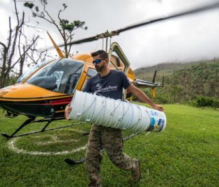 Samaritan's Purse staff member Ricky Geigel unloads relief supplies for a remote mountain community in Puerto Rico.