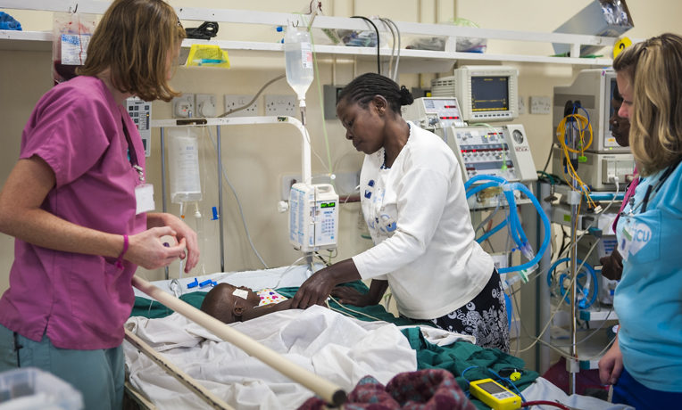 Tenwek Hospital in Kenya serves patients in Jesus' Name. Christian mission hospital staff attend to a patient