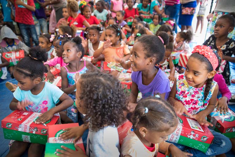 Happy children at an Operation Christmas Child shoebox event in the Caribbean