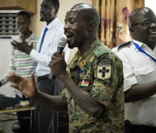 An army chaplain of the Republic of South Sudan leads his colleagues in song during the opening of the "Leading Using Biblical Principles" workshop in Juba.