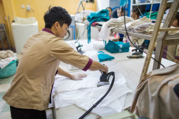 Trang is learning how to iron, fold sheets and blankets, make beds, and clean.