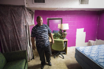 Pastor Edward shows some of the living quarters where otherwise-homeless families live.