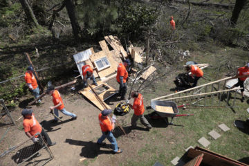 Volunteers work hard to remove yard debris. 