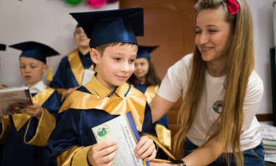 Shoebox recipient Oksana Faik congratulates one of her students who just graduated from The Greatest Journey.