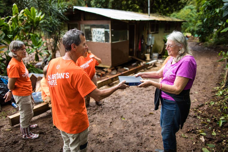 U.S. Disaster Relief volunteers homeowner Bible Kauai Hawaii