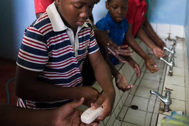 Students on Dominica washing their hands. 