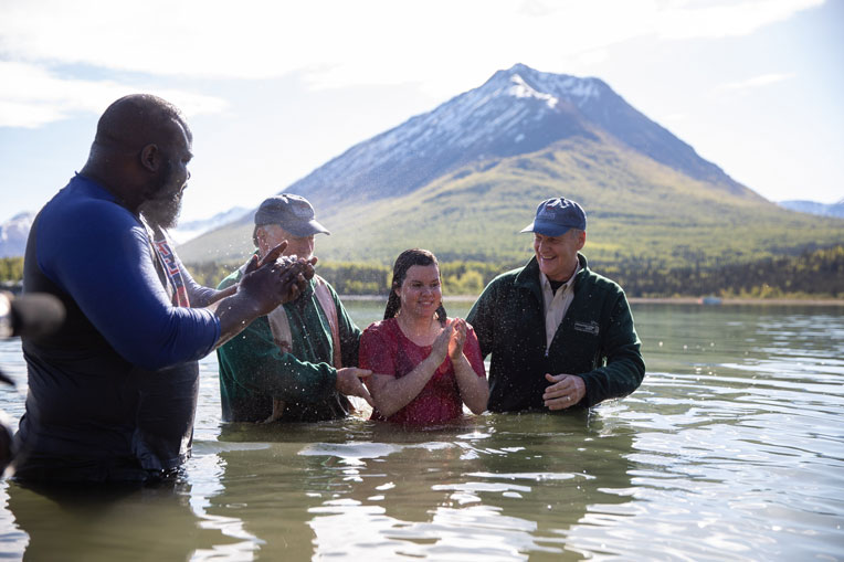 military couple baptized in Lake Clark