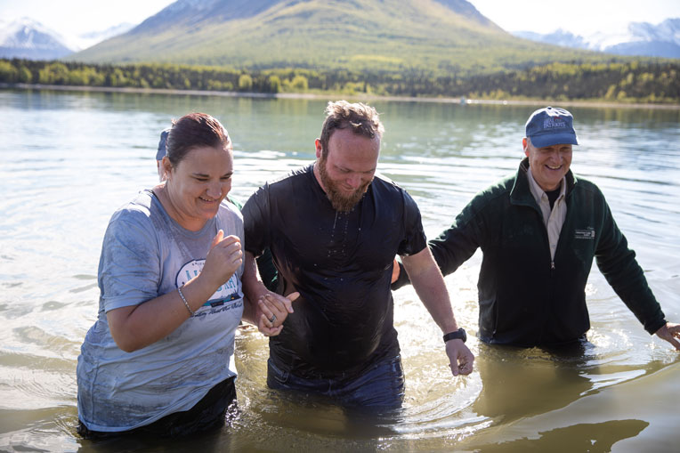 military couple baptized in Lake Clark