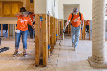 Volunteers finish clearing debris and treating for mold at the home of Lupe and Maria Aguirre.