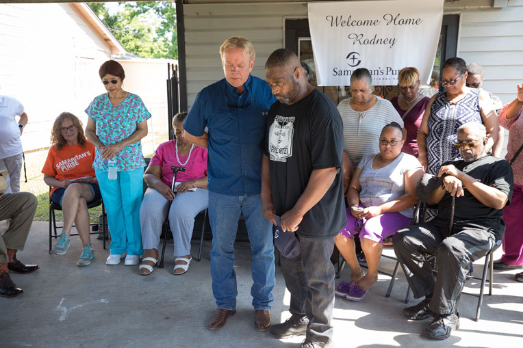 Praying with Rodney Turner, Hurricane Harvey victim