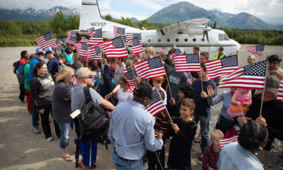 Military couples are greeted by an enthusiastic crowd at Samaritan Lodge Alaska.