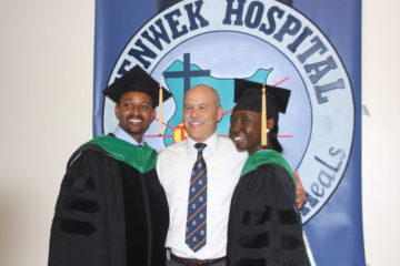 Dr. Odera and Dr. Leta with Dr. Russ White, Tenwek's veteran chief surgeon, in 2013 at the completion of their general surgery residency training.  