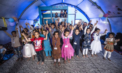 Children perform together at their graduation from the child-friendly space classes.
