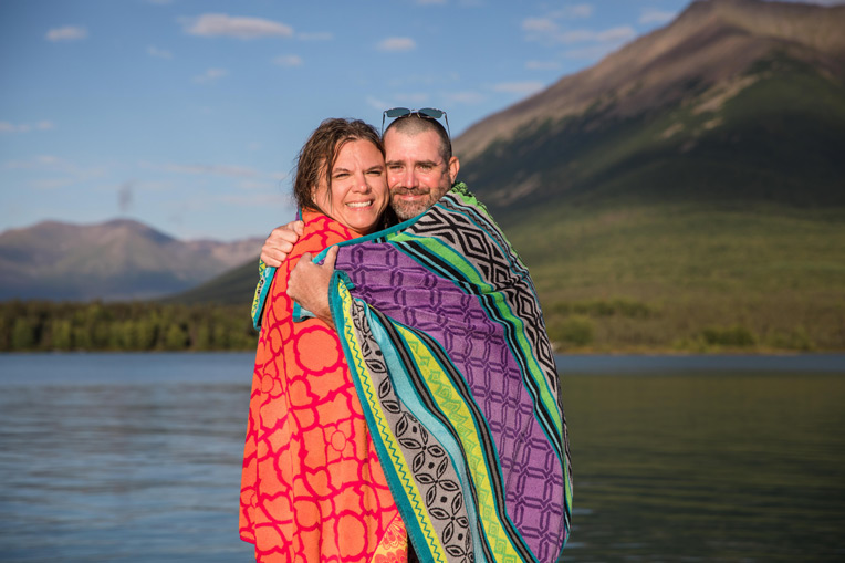Army Staff Sergeant John Arp and his wife Shelly warm up after the polar plunge. Each week at Samaritan Lodge couples jump into chilly Lake Clark.