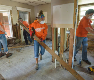 Samaritan's Purse volunteers remove waterlogged walls and floors after south central Wisconsin was inundated with widespread flooding.