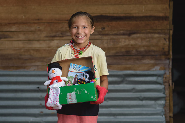 Kelly, one of 14 children from a local Colombian family, had never received gifts like these before. 