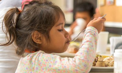 A young girl has a hearty meal at our shelter in Bucaramanga.