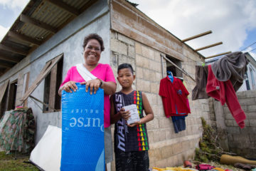 The roof on Rosa and Tony's home was blown off during the typhoon, flooding their home with heavy rain. 