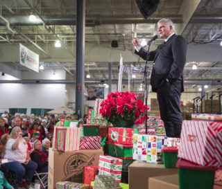 Franklin Graham thanks Operation Christmas Child shoebox processing center volunteers during a special event in Charlotte, N.C.