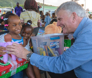 Franklin Graham helps distribute Operation Christmas Child shoeboxes in Antigua.