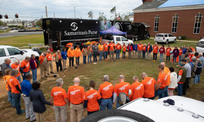 Samaritan’s Purse volunteers in Panama City, Florida, pray before beginning their day of serving hurricane victims in Jesus’ Name.