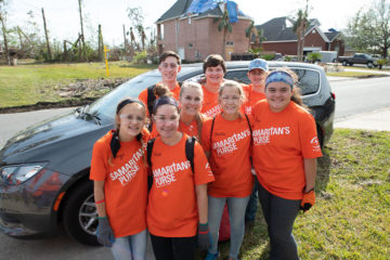 Students from Landmark Christian School served devastated homeowners with a cheerful spirit.