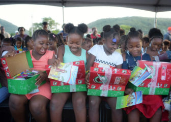 Children in Antigua open their shoeboxes with glee!